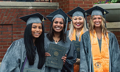 2021 female graduates standing in group