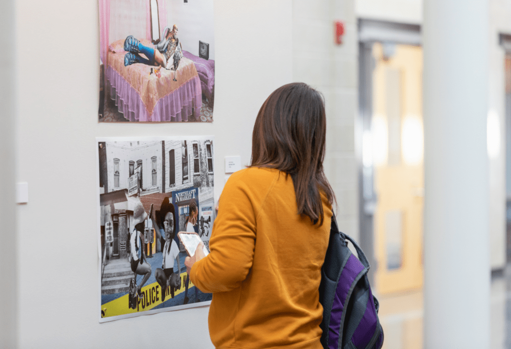 female student viewing art