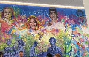 Colorful wall mural of faces and icons of Central Piedmont