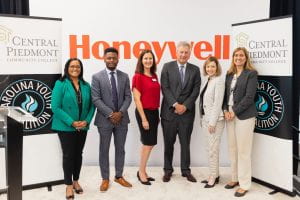 Group of smiling men and women who were Scholarship presenters from Honeywell