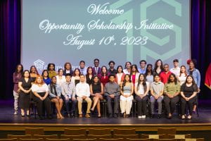 Group photo of Opportunity Scholars on stage.