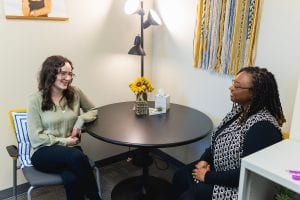 Counseling Services talks around an inviting table.