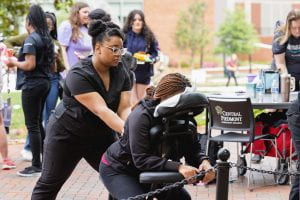 Student receives a chair massage during Counseling on the Green event